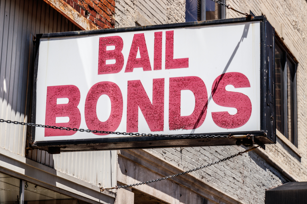 Bail,bonds,sign,chained,to,a,building,i