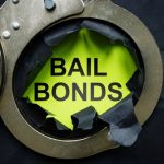 Bail,bonds,inscription,and,handcuffs.