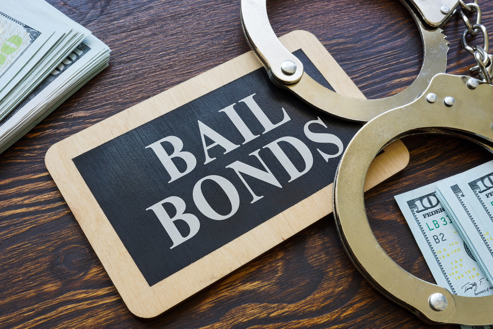 Plate,bail,bonds,and,handcuffs,on,it.