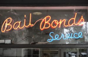 Neon,bail,bond,sign,in,window