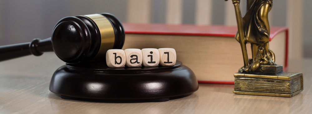 Word,bail,composed,of,wooden,dices.,wooden,gavel,and,statue